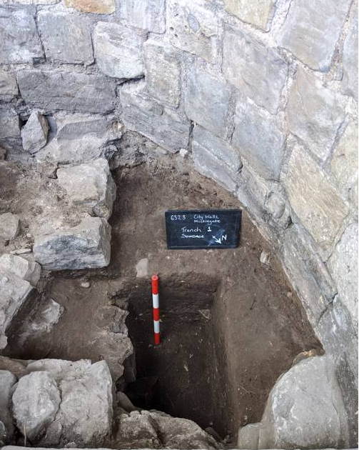 Archaeological trial hole in city wall walkway